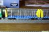 W126_Holztransportwg. Sggmrrs 90, blau-gelb, #1; CD-CARGO; Ep.VI; SUDEXPRESS_01
